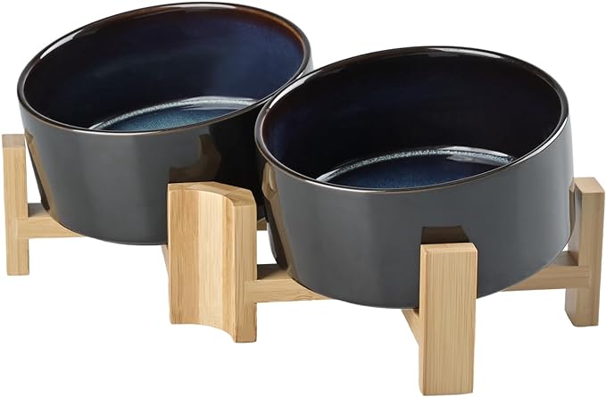 SPUNKYJUNKY 15° Slanted Ceramic Dog and Cat Bowl with Wooden Stand, Tilted Bulldog Food and Water Bowl No Slip Non-Spill for Cats Medium Dogs Big Face Pets 28.7 OZ (3.6 Cups, Starry Blue × 2)